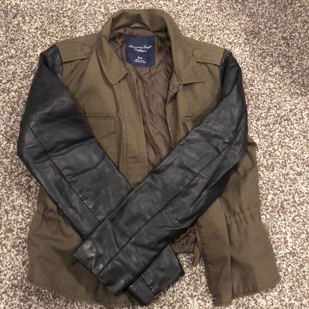 Dark green jacket with leather sleeves